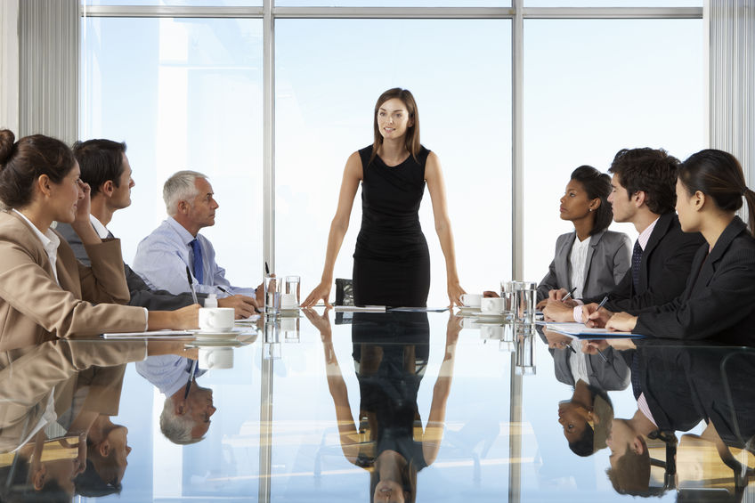 A group of people sitting around a table.