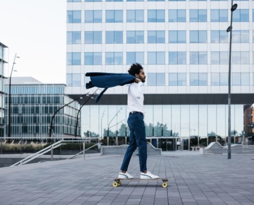 A person on a skateboard in front of a building.