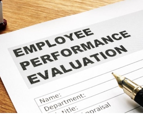 A paper that has employee performance evaluation written on it.