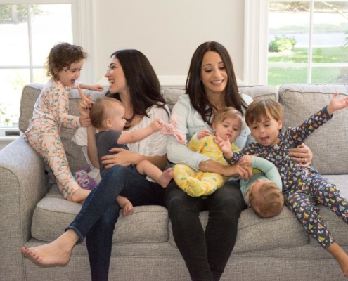 A group of people sitting on top of a couch.